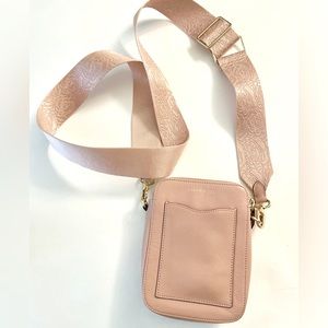 Taryn Rose pink vertical crossbody handbag.